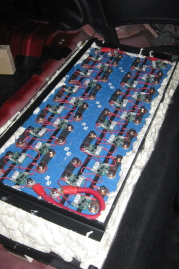 EV batteries in a welded metal rack